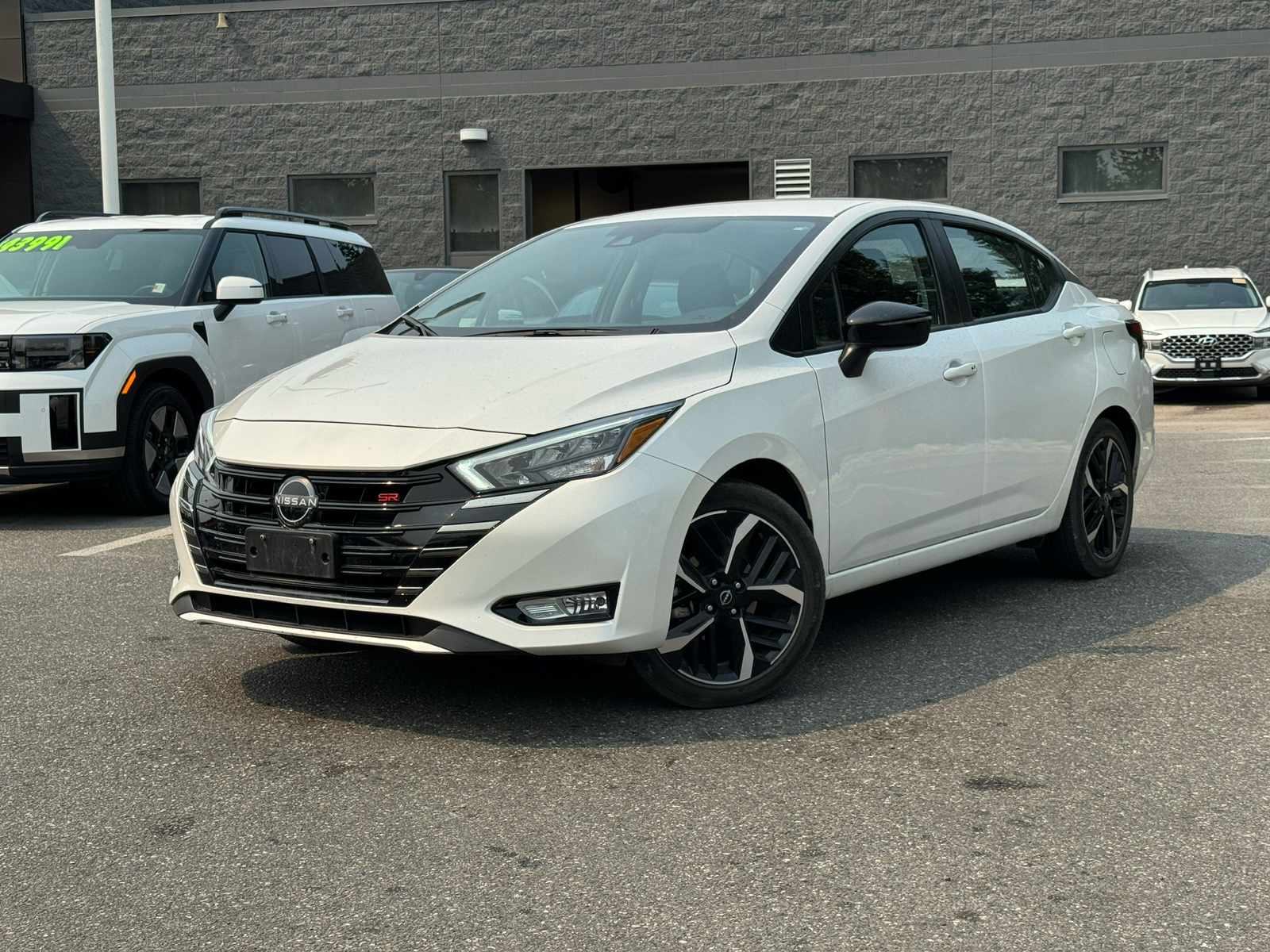 White 2024 Nissan Versa Sedan Front-Wheel Drive Continuously Variable Transmission